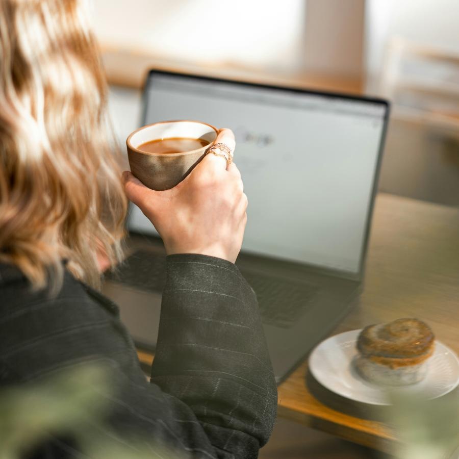 a person holding a cup of coffee